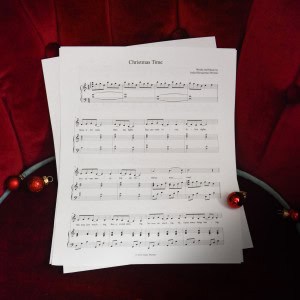 Sheet music to "A Missionary". The music is surrounded by Christmas bulbs on a red and brown background.