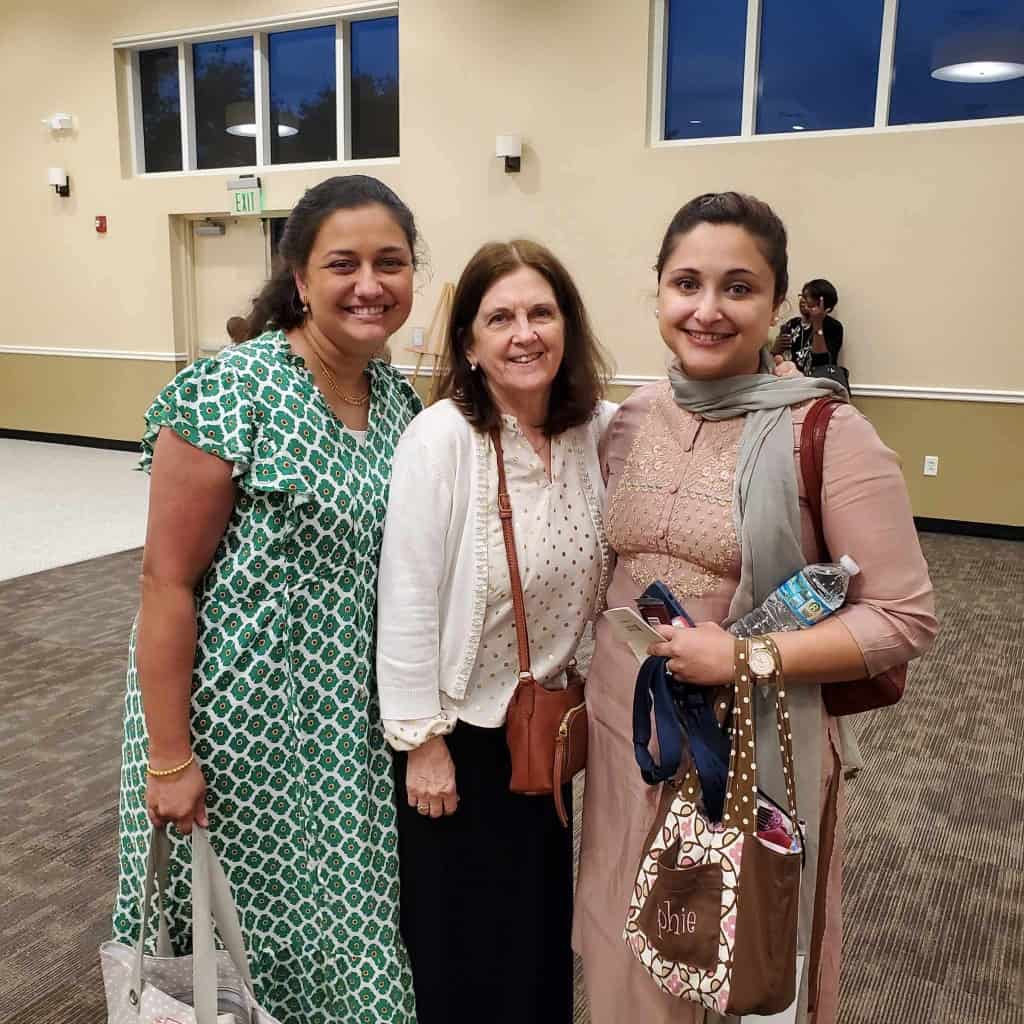 Image of Ruthie Bianchi with Lois and India at a church function.