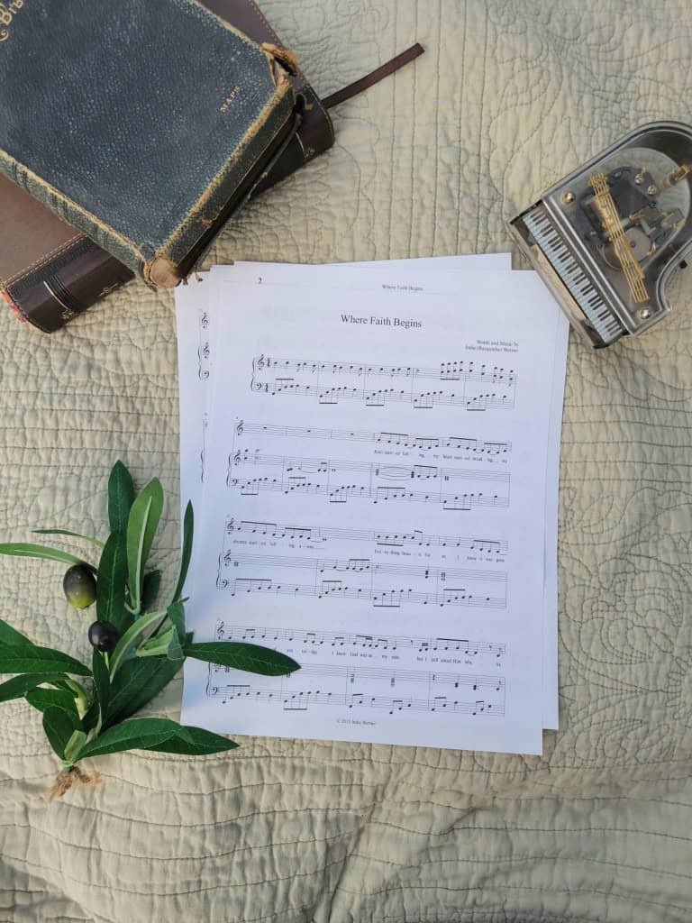 Sheet music to "For Such A Time As This". The music is surrounded by a model piano, a bible, and a small leafy plant.
